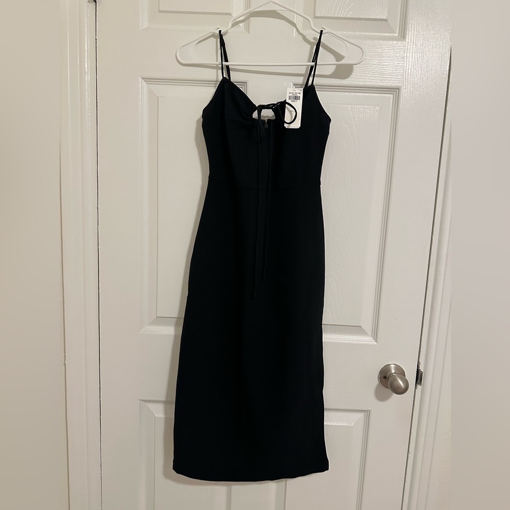 Abercrombie and Fitch black midi dress with side slit and knot at the front.